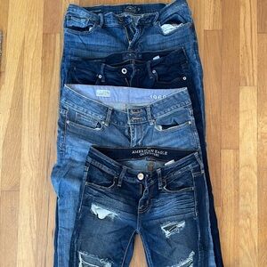 Four pair Like new jeans- Lucky, GAP and American Eagle different styles.